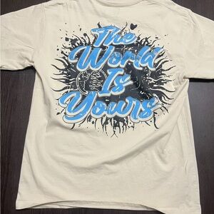 Cream Graphic T-Shirt with Blue and Black Design